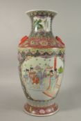 A LARGE CHINESE FAMILLE NOIR / ROSE PORCELAIN VASE, with twin bat formed handles, painted with two