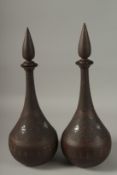 A LARGE PAIR OF 19TH CENTURY PERSIAN QAJAR GOLD AND SILVER INLAID WIN BOTTLES AND STOPPERS, (one