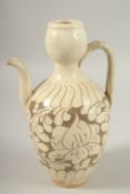 A CHINESE CIZHOU GLAZED POTTERY EWER, 25.5cm high.