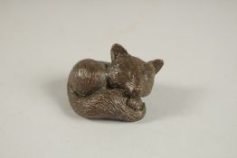 A BRONZE OKIMONO OF A FOX.