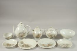 A JAPANESE VINTAGE PORCELAIN TEA SET, each piece painted with landscape scenes and inscriptions, (