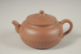 A CHINESE YIXING TEAPOT, with incised calligraphy, impressed marks to inner lid and base.