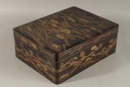 A VERY FINE JAPANESE MEIJI PERIOD GILT AND BLACK LACQUER BOX, beautifully decorated with landscape
