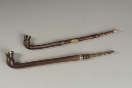 TWO FINE OTTOMAN TURKISH SILVER AND BRASS INLAID WOODEN SMOKING PIPES, longest 43cm long, (2).