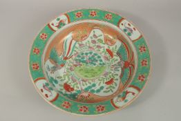 A LARGE CHINESE FAMILLE ROSE PORCELAIN BOWL, painted with phoenix and fish, further decorated with
