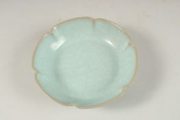 A CELADON GLAZE PETAL FORM DISH, 13.5cm wide.