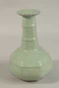 A CHINESE CRACKLE GLAZE CELADON BOTTLE VASE, 23.5cm high.