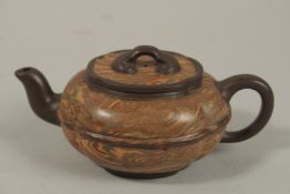 AN UNUSUAL CHINESE YIXING TEAPOT, of lobed form with naturalistic striations, the base and
