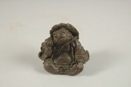 A BRONZE OKIMONO OF A FROG.