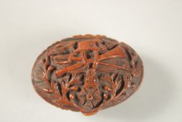A CHINESE EXPORT CARVED NUT BOX, with European decoration.
