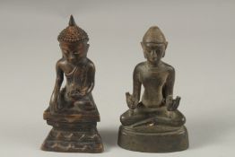 TWO CHINESE BRONZE BUDDHAS, 17cm and 19cm high.