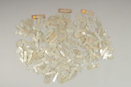 A LARGE QUANTITY OF CHINESE CARVED MOTHER OF PEARL COUNTERS, various forms and sizes, (qty).