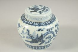 A CHINESE BLUE AND WHITE PORCELAIN JAR AND COVER, painted with 'kui dragons', 13cm high.