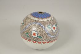 A TURKISH GLAZED POTTERY HANGING BALL ORNAMENT, 16cm high.