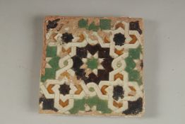 A FINE 16TH CENTURY ADALUSIAN SPANISH TOLEDO GLAZED POTTERY TILE, 14.5cm square.