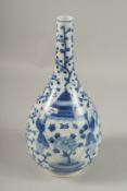 A CHINESE BLUE AND WHITE PORCELAIN BOTTLE VASE, each side painted with two boys carrying a large
