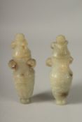 A PAIR OF 18TH CENTURY CARVED JADE VASES AND COVERS, with ram mask handles and carved scrolls,