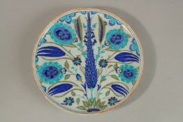 A TURKISH OTTOMAN IZNIK GLAZED POTTERY PLATE, 30cm diameter.