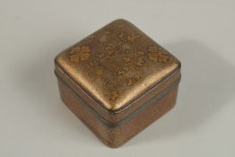 A JAPANESE MEIJI GILT LACQUER BOX, with floral decoration and pewter rim, 7.5cm x 7.5cm.