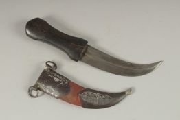 A 19TH CENTURY OTTOMAN HORN HILTED DAGGER, with silver inlaid steel mounted scabbard, 28cm long.