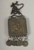 AN 18TH CENTURY OTTOMAN GREEK BRASS PENDANT, with embossed icon of Madonna and child, pendant 6.