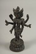 A 19TH CENTURY TIBETAN OR NEPALESE BRONZE FIGURE OF A MULTI-ARM DEITY, 19cm high.