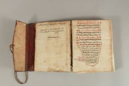 A LATE 18TH CENTURY NORTH AFRICAN LEATHER BOUND QURAN, signed Abo Alkassem Ben Ibrahim Alajami,