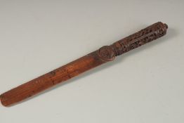 A 19TH CENTURY SOUTH INDIAN MYSORE CARVED WOODEN PAGE TURNER, 31cm long.