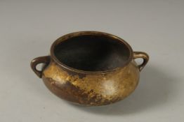 A GOOD SMALL 18TH CENTURY CIRCULAR BRONZE TWIN HANDLE CENSER, Kangxi mark to base, 10cm diameter.