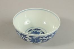 A CHINESE BLUE AND WHITE PORCELAIN BOWL, with six-character mark, 12cm diameter.
