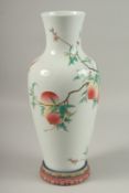 A LARGE CHINESE FAMILLE ROSE PORCELAIN PEACH VASE, with stand, vase 39.5cm high.