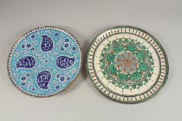 TWO ISLAMIC GLAZED POTTERY PLATES, largest 34cm diameter, (2).