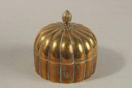 A 19TH CENTURY MUGHAL INDIAN DOMED BRASS PANDAN BOX, 12cm high.