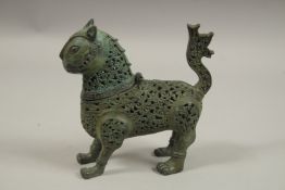 AN ISLAMIC PIERCED METAL LION CENSER, 18cm long.