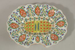A TURKISH KUTAHYA GLAZED POTTERY FACE WASH PLATE, 37cm x 29cm.