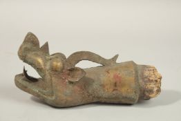 A RARE CHINESE OR TIBETAN POSSIBLY MING DYNASTY GILT COPPER DRAGON HEAD FINIAL, probably a furniture