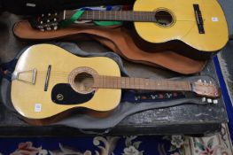 A classical guitar and case.