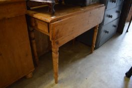 A pine Pembroke table.