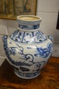 A good large Chinese blue and white twin handled jar decorated with dragons.