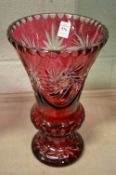 A large ruby tinted cut glass baluster shaped vase.