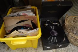 A Columbia portable gramophone and a quantity of records.