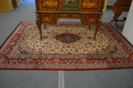 A large machine made Persian style carpet, 340cm x 240cm.