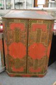 An unusual chinoiserie decorated hanging corner cupboard.