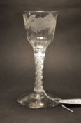 A George III wine or cordial glass with opaque twist stem, the bowl engraved with flowers (small