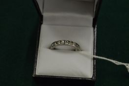 A white metal and diamond full eternity ring.