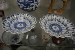 A pair of Chinese blue and white lotus form brush washers.