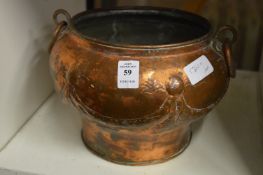 A copper flower bowl.