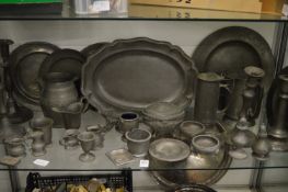 A quantity of pewter ware to include plates, flagons etc.