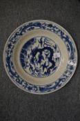 Large Chinese circular blue and white decorated dish.