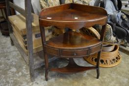 A mahogany corner washstand.